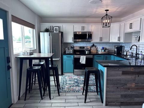 The kitchen has all the pots, pans, dinnerware, silverware and spices you need.