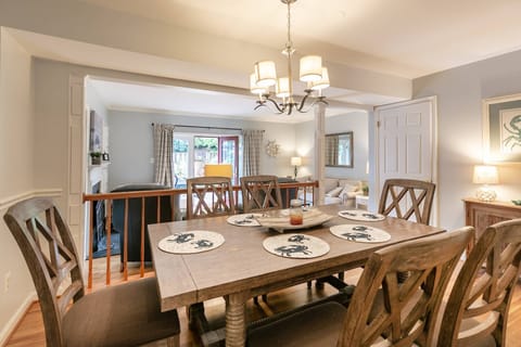 Gather around the large dining room overlooking the living room.