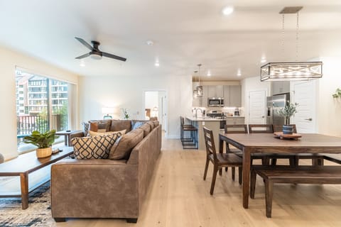 Your open-concept retreat flows seamlessly from living to dining to kitchen, with modern finishes and city views from your private balcony.