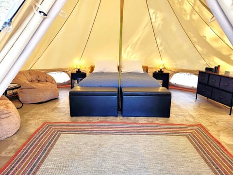 Roughing it in a queen bed bell tent