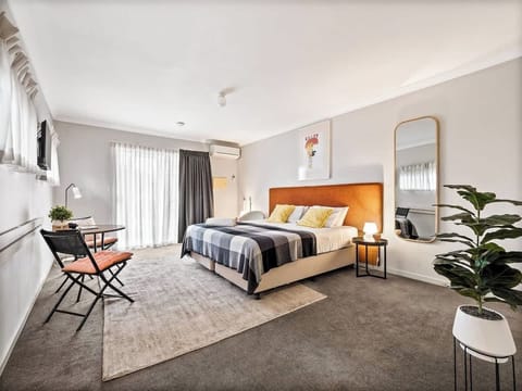 Sink into the plush king bed after a day exploring Margaret River, with soft lighting, built-in storage and calming interiors creating a restful place to recharge.