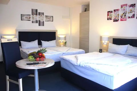 Family Room | Down comforters, individually furnished, desk, iron/ironing board