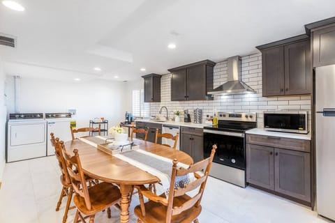 Kitchen and dining area with daylight windows.