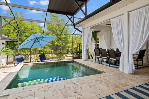 Your private oasis with shaded seating and sparkling heated pool.