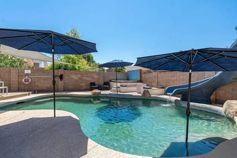 Wonderful pool with a slide!  Great for fun or basking in the sun.