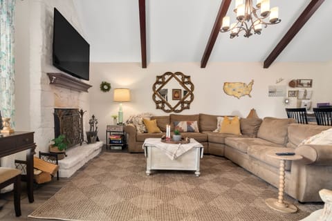 Living area is gorgeous with vaulted ceilings, and a pottery barn sectional