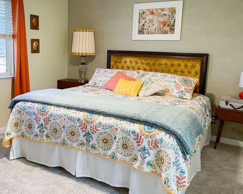 Mid-Century bedroom complete with a view of the beautiful garden through the window!