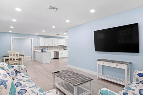 Palm Retreat is a three bedroom two bath oversized cottage featuring an expansive fully equipped kitchen and living room, with two queen memory foam sleeper sofas and a patio