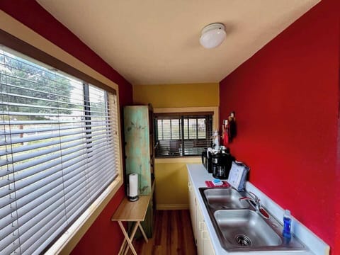 Slider window in kitchen opens into private screened patio for easy outdoor dining!