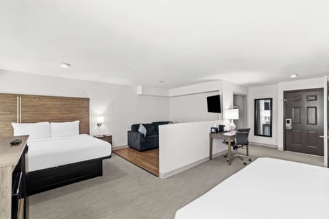 Suite, Multiple Beds, Non Smoking | Pillowtop beds, blackout drapes, iron/ironing board, rollaway beds