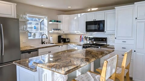 The large kitchen, updated in Fall 2024, has plenty of space to cook for everyone.