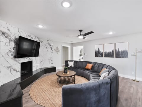 With a couch as big as this one, there’s plenty of room for everyone to settle into this living room!