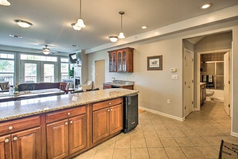 Open-concept kitchen with bar seating and direct flow into the living room – perfect for entertaining.