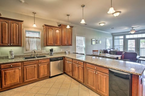 Spacious kitchen with granite countertops, bar seating, and plenty of room for cooking and entertaining.