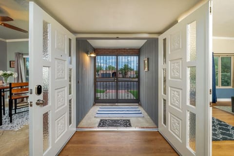 Light-filled entry hall connecting the kitchen and living room