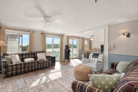 Cozy up by the fire in this spacious living room with stunning views!