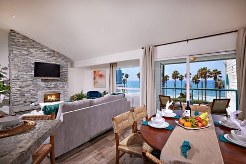 living/dining area & balcony with ocean views