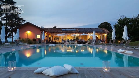 Seasonal outdoor pool, open 9:00 AM to 7:00 PM, pool umbrellas