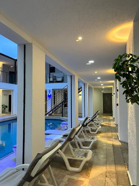 Outdoor pool, open 8:00 AM to 10:00 PM, sun loungers