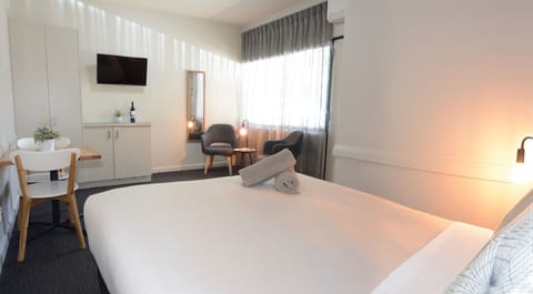 Executive Queen | Desk, blackout drapes, iron/ironing board, cribs/infant beds