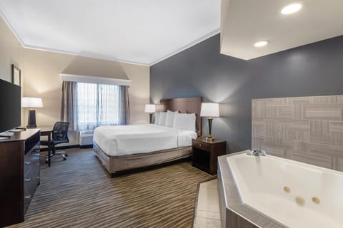 Suite, 1 King Bed, Non Smoking, Jetted Tub | Premium bedding, in-room safe, blackout drapes, iron/ironing board