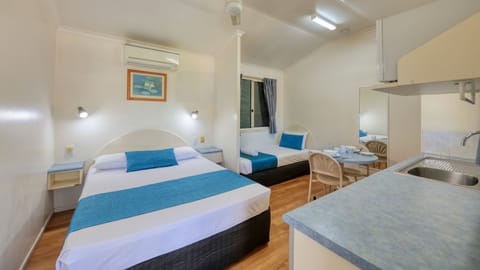Triple Room | Blackout drapes, iron/ironing board, WiFi (free), bed sheets