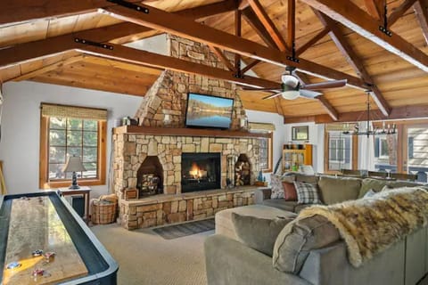 View from front door, shuffle board, large custom fireplace, cozy cabin vibe