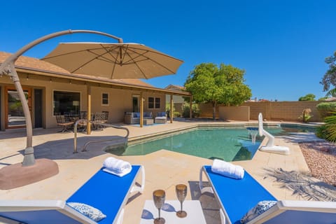 Huge heated pool with plenty of sitting spaces to enjoy the oversized back yard.