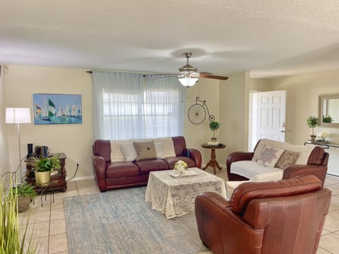 Warm, Cozy living room with super comfortable leather couches for your leisure