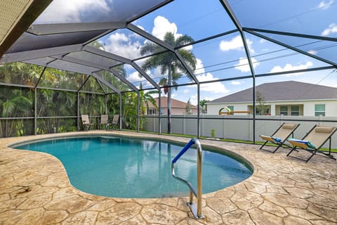 Villa Blanca has an electric-heated pool & privacy provided by the neighbor's fence