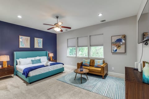 Our primary bedroom includes a King Bed with 50 inch TV with love seat.