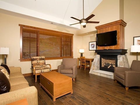 Relax in front of the moss rock gas fireplace