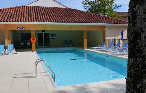 Enjoy the lovely seasonal outdoor pool.