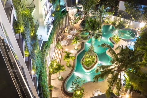 Outdoor pool, open 7:00 AM to 10:30 PM, free cabanas, pool umbrellas