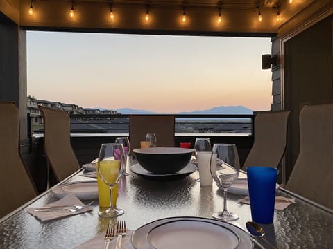 Rooftop patio with large table for entertaining. 