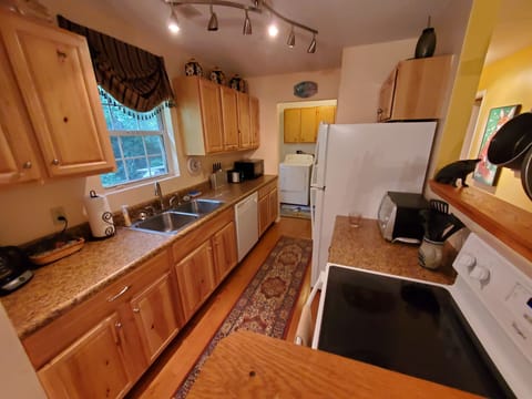 Well equipped, fully furnished kitchen. Laundry room off the kitchen.