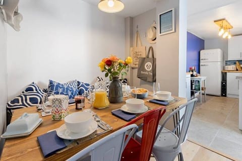 Dining area with dining table and chairs leading to the kitchen
