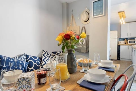 Dining area with dining table and chairs leading to the kitchen