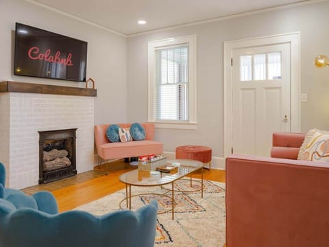 Living Room with Smart TV and Sunroom Access