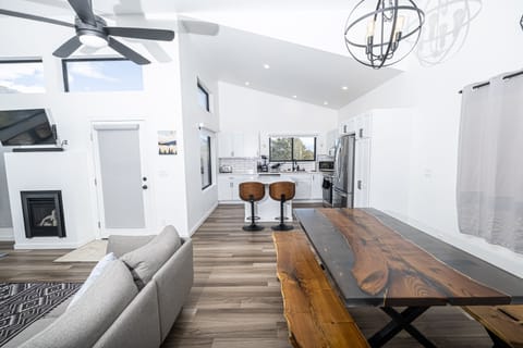 A Large custom wood and resin dining table has space for the whole group!