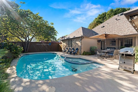 Enjoy heated pool with outdoor dining and BBQ