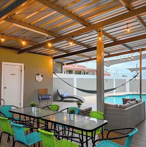 Gazebo with sitting areas and a kitchenette with BarBQ.