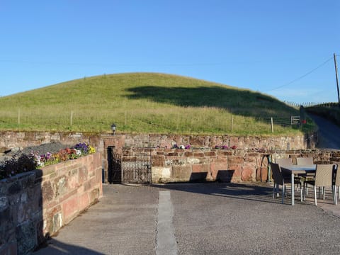 Quiet seating area in the courtyard right outside the living area | Liftingstane Dairy Cottage - Liftingstane, Closeburn, near Thornhill