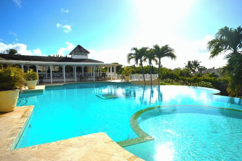 Club house view which includes swimming pool