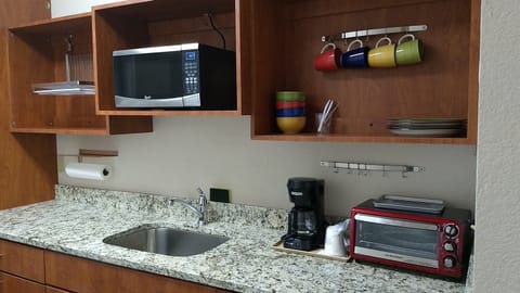 Suite, 1 King Bed, Non Smoking | Private kitchen | Fridge, microwave