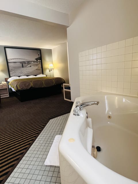 Deluxe Studio Suite, 1 King Bed, Non Smoking | Desk, blackout drapes, iron/ironing board, cribs/infant beds