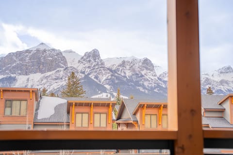Take in the crisp mountain air from your window, framing a winter wonderland of snow-capped peaks.