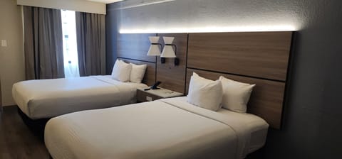 Premium bedding, desk, iron/ironing board, free cribs/infant beds