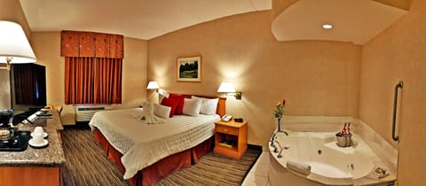 Room, 1 King Bed, Jetted Tub | Desk, iron/ironing board, WiFi (free), alarm clocks