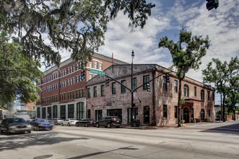 Street-level view of the building entrance on a tree-lined downtown block.